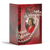 Memorial brochure cover with red rose design, pearl border, and oval portrait