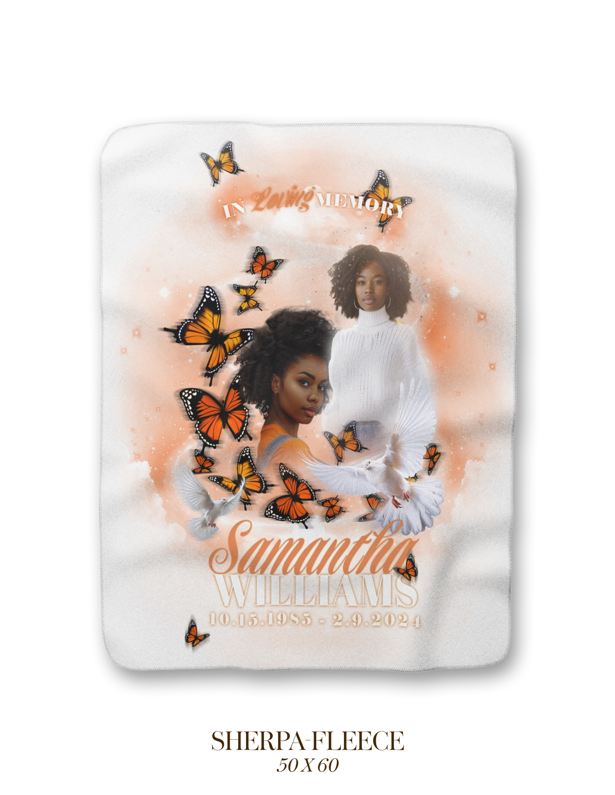 White memorial blanket with orange butterfly swirls and two cherub portraits