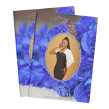 Memorial booklet cover with blue rose design and oval portrait of a woman in black dress
