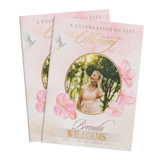 Memorial booklet cover with pink floral frame and circular portrait photo window