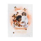 White memorial blanket with orange butterfly swirls and cherub portrait medallion