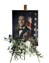 Framed military funeral portrait of man in uniform with American flag and floral bouquet