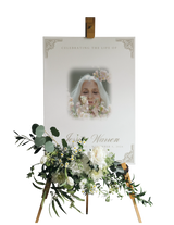 Funeral portrait print with floral wreath and name plate, on standing display