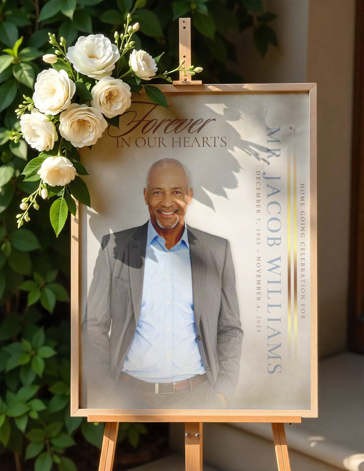 Funeral portrait print on easel framed with white flowers